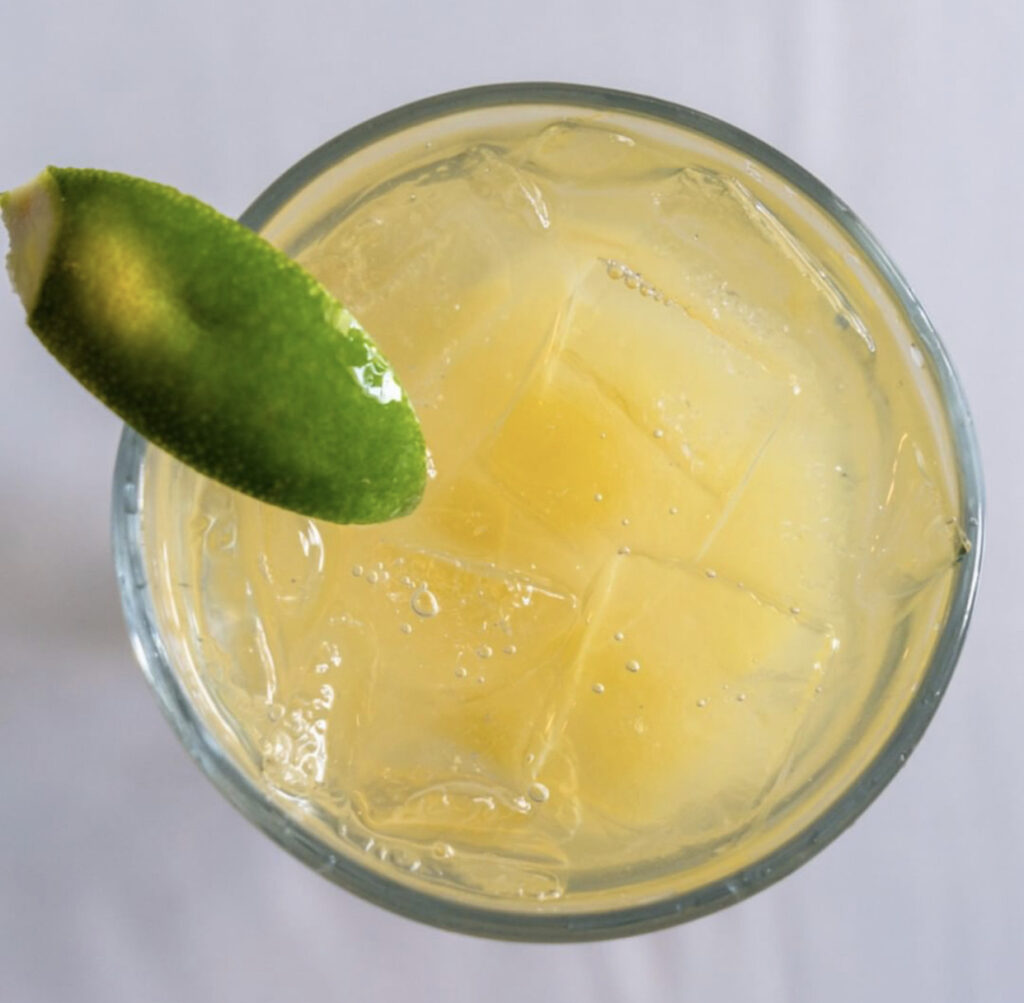 Overhead pictures of a margarita with a lime
